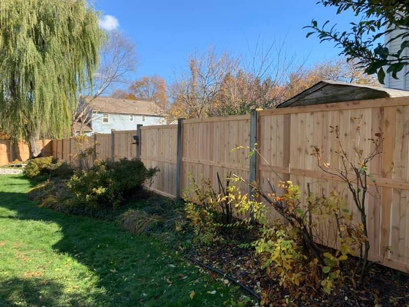 Wooden Privacy Fence installed in a backyard