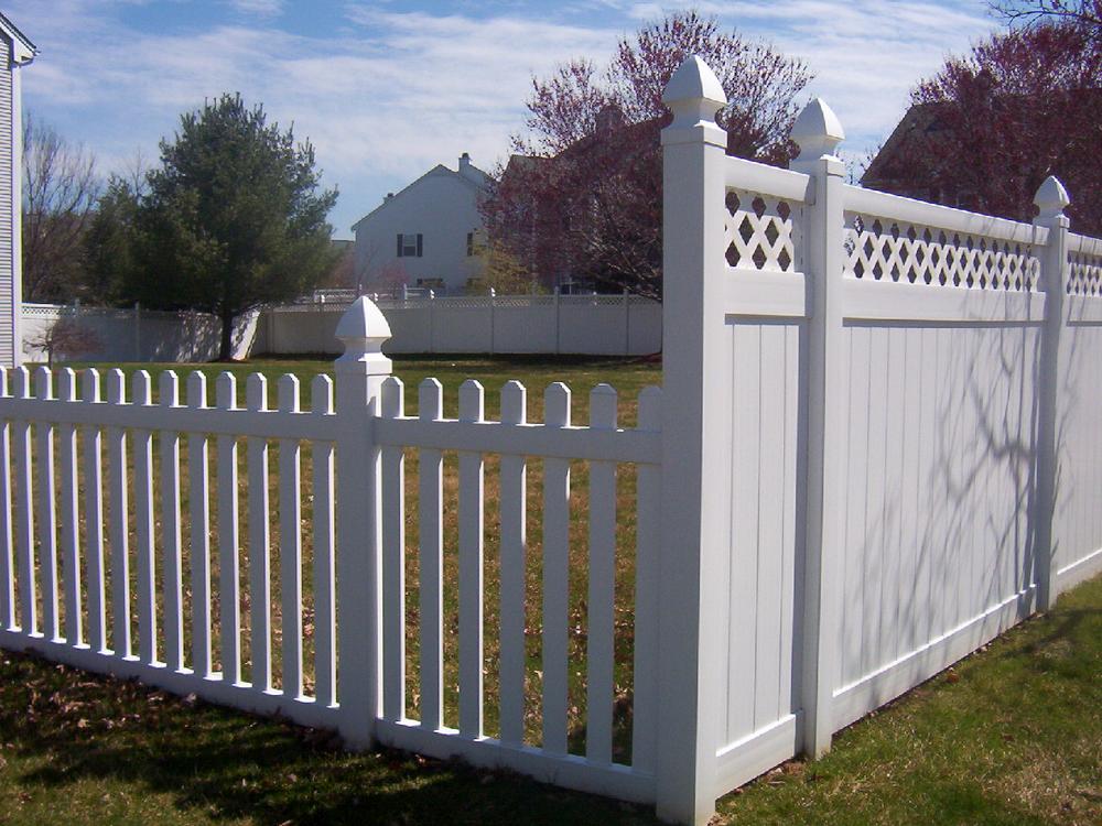 Backyard vinyl fencing installed by Horner Brothers Fence - picket fence and a privacy fence.